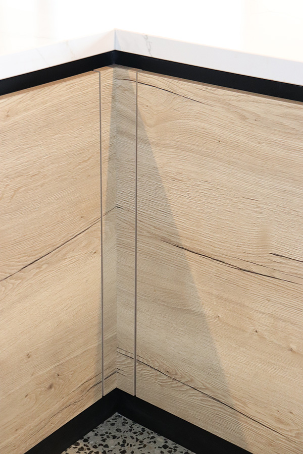 Shadow line handleless detail on custom cabinetry
