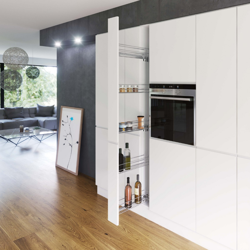 Tall pull out larder unit with chrome baskets in a white kitchen