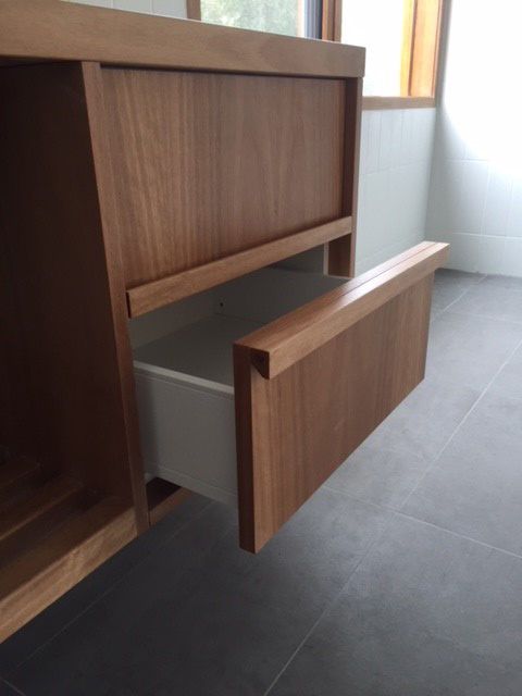 Integrated timber handle routed into a cabinet door