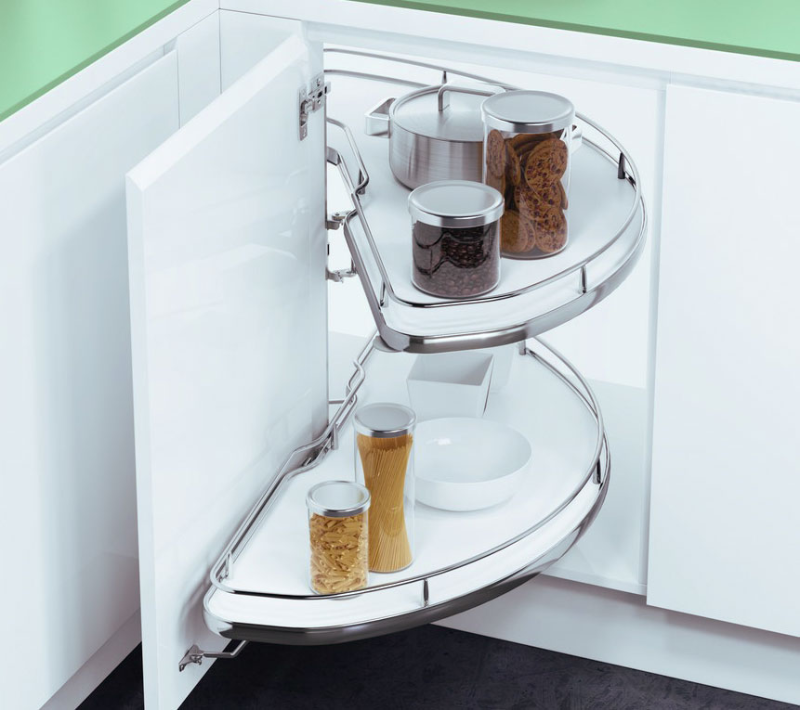 Corner cabinet with swing out rotary shelves storing jars and pots