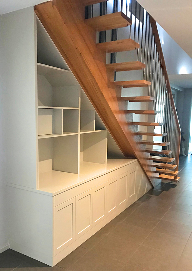 Custom bookcase built under a staircase