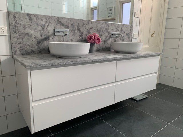Wall hung vanity with no handles and soft close drawers