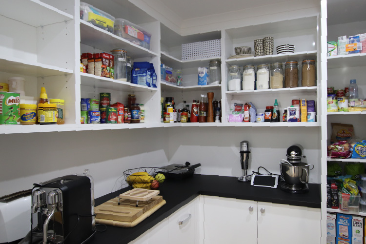 Custom pantry with open shelving and bench space by Complete Style Joinery