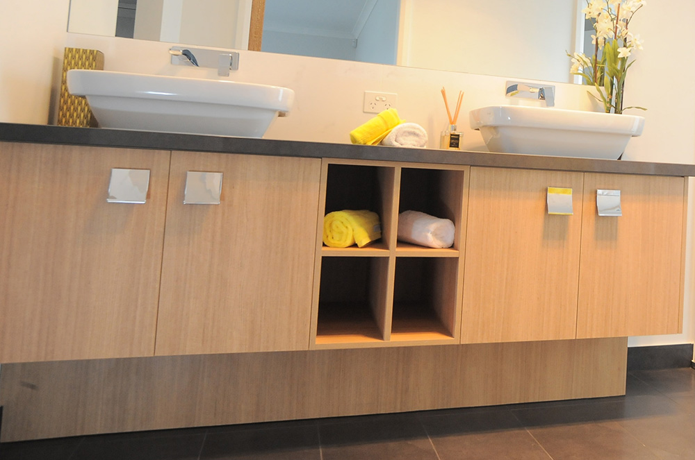 Vanity with towel pockets and integrated storage