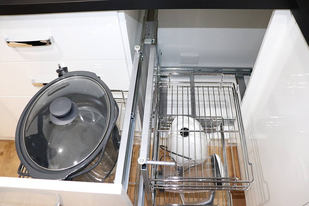 Pull out wire storage baskets with crock pot and kitchen essentials