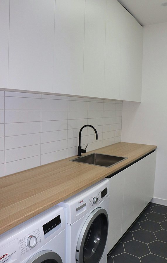 Timber bench in a modern laundry
