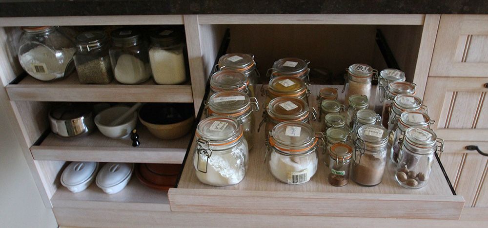 Roll out open shelving with mason jars of dry goods