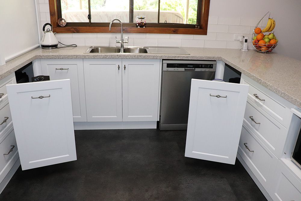 Kitchen base cabinet with pull out shelves and open doors