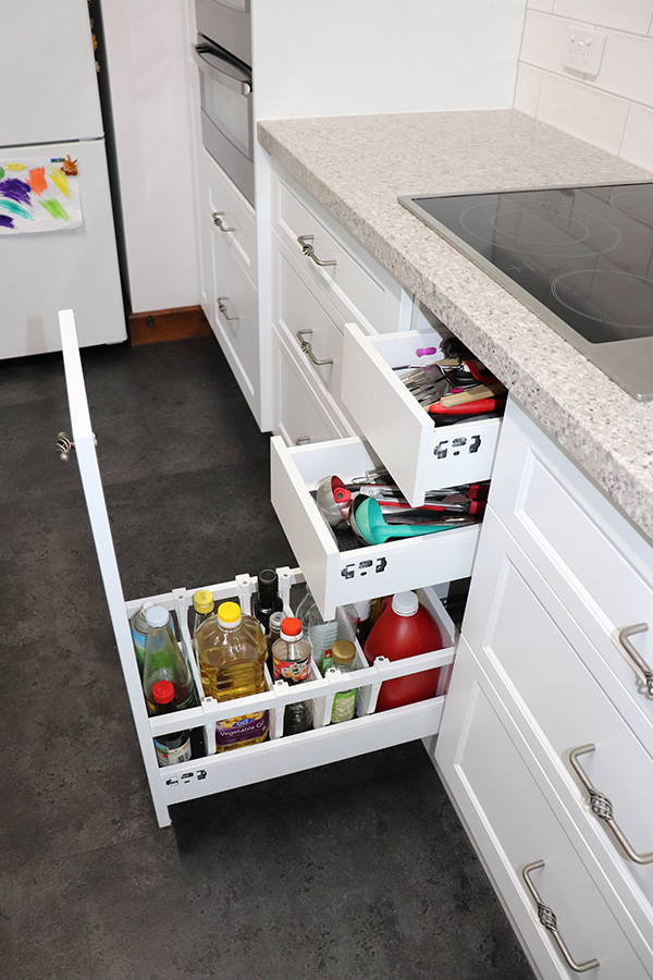 Deep kitchen drawers with internal dividers and spice jars