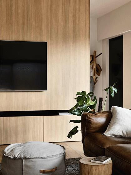 Natural raw living room cabinetry with warm timber tones