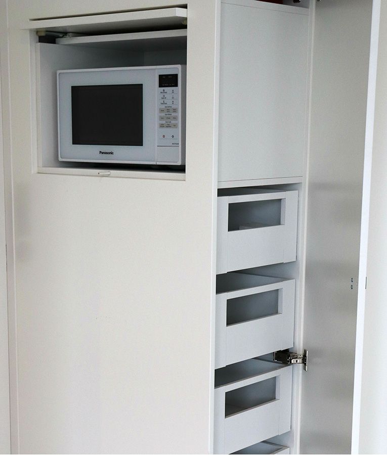 Clever Storage Of Hidden Microwave In Pantry